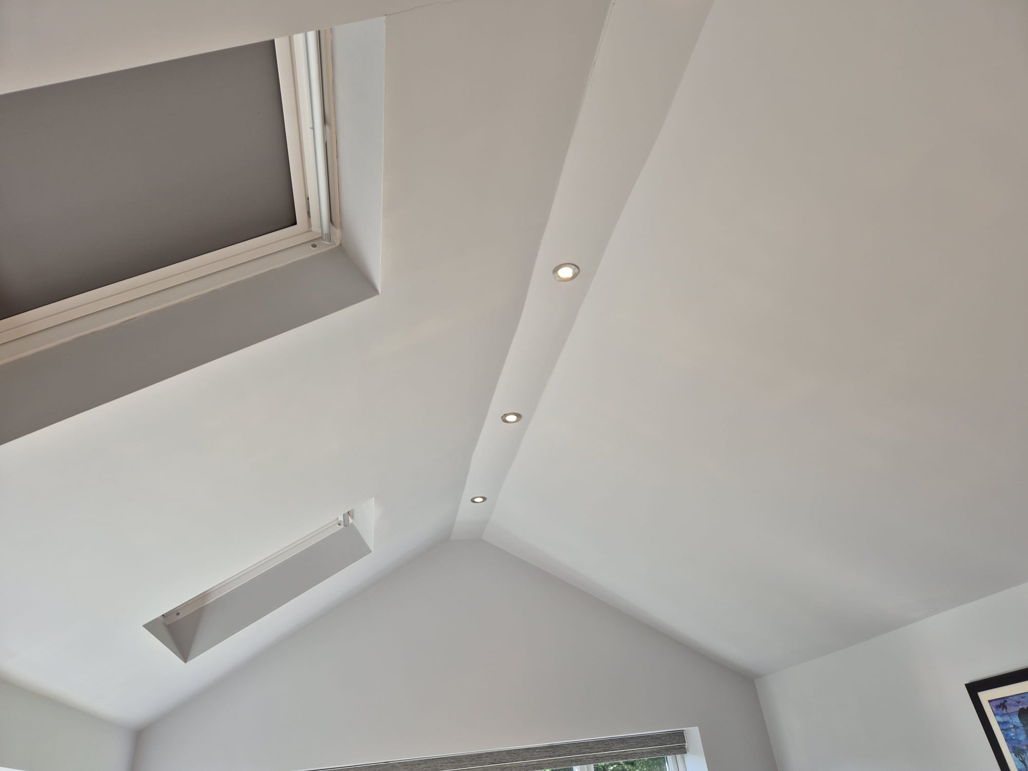 Recessed spotlights in a vaulted ceiling